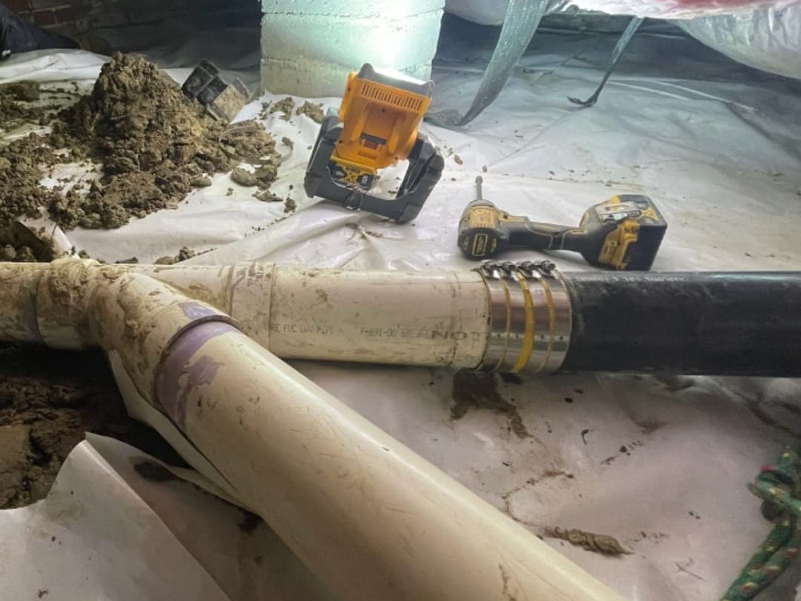 A-Team Plumbing technician on a drain service call in Durham